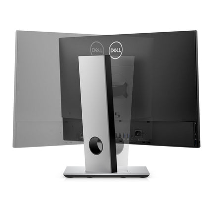Rear view of the Dell OptiPlex 5490 AIO 23.8″ FHD, showing its silver stand in two swivel positions, visible ports, round cable management hole, and Windows 11 Pro interface. - View 3