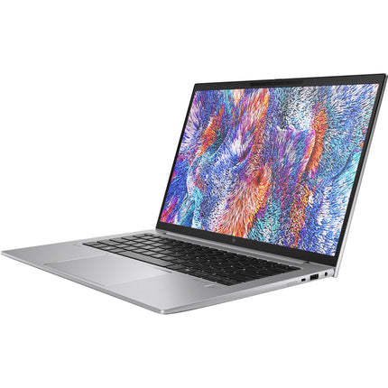 Angled view of a refurbished silver HP ZBOOK FIREFLY 14 G11 A laptop, open with colorful display and black keyboard visible. - View 4