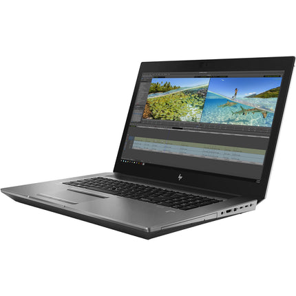 Front view of a silver HP ZBook 17 G6 laptop with a 15.6” display, open on a white background, displaying a video editing program featuring tropical beach footage. This refurbished workstation, powered by an Intel Core i7-9750H processor, 32GB DDR4 RAM, and Nvidia Quadro T1000 4GB graphics card, is ideal for creative professionals seeking robust performance. - View 5