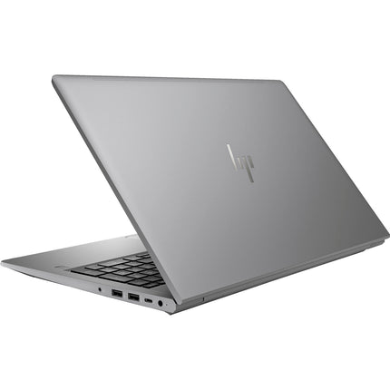 Angled view of a refurbished silver HP ZBOOK Power G10 laptop (15.6″), partially open to reveal its keyboard, touchpad, and side ports. The iconic HP logo appears on the back of the screen. Key specs include Intel Core i7-13800H processor, 32GB DDR4 RAM, 1TB NVMe SSD, and NVIDIA RTX A1000 6GB graphics card. - View 2