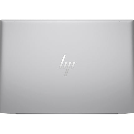 Top-down view of a sleek, silver HP ZBOOK FIREFLY 16 G11 laptop shown closed, with the HP logo centered on the smooth lid. No ports or other markings are visible. This refurbished 16” FHD laptop features modern style and powerful specs: Intel Core Ultra 7 165H processor, 64GB DDR4 RAM, and a 1TB NVMe SSD. - View 2