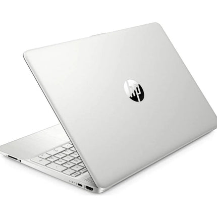 Angled view of a silver HP 15-DY2XXX laptop with its closed lid featuring a central logo and its open keyboard deck. - View 2