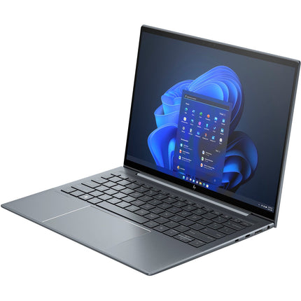 A sleek, thin HP DRAGONFLY G4 13.5” Touch laptop with a silver body is shown in an angled view to the left, open and displaying the Windows 11 home screen with a centered Start menu and app icons for a modern look. Featuring an Intel Core i7-1365U 1.8GHz processor, 32GB DDR4 memory, and a 1TB NVMe SSD, this refurbished HP laptop emphasizes both elegance and high performance. - View 4
