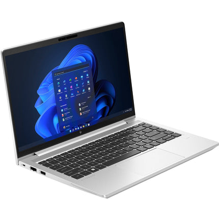 Refurbished HP ProBook 640 G10 laptop with a 14” FHD display and black keyboard, shown in an angled front left view, open to the Windows 11 home screen. Features include Intel Core i5-1345U processor, silver chassis, 32GB DDR4 RAM, and 512GB NVMe SSD. - View 4