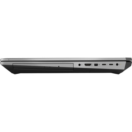 Side view of the closed HP ZBook 17 G6 laptop displaying multiple ports including USB, HDMI, audio jacks, and a slim disc drive on the left. This refurbished model offers a 15.6” display, Intel Core i7-9750H processor, 32GB DDR4 RAM, 512GB NVMe SSD storage, and Nvidia Quadro T1000 4GB graphics for professional performance. - View 4