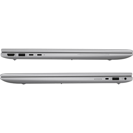 Side view of two closed silver laptops, including a refurbished HP ZBOOK FIREFLY 16 G11 with Intel Core Ultra 7 165H processor, stacked in opposite directions to display their ports such as USB, HDMI, and SD card slots. - View 3